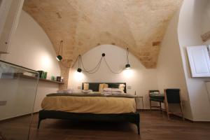 Postel nebo postele na pokoji v ubytování MATTEI LUXURY B&B