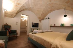 TV a/nebo společenská místnost v ubytování MATTEI LUXURY B&B