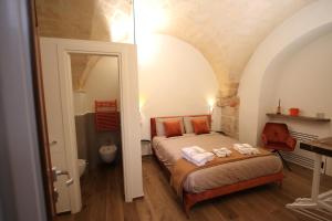 Postel nebo postele na pokoji v ubytování MATTEI LUXURY B&B