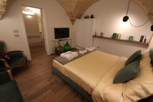 TV a/nebo společenská místnost v ubytování MATTEI LUXURY B&B