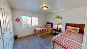 Ένα ή περισσότερα κρεβάτια σε δωμάτιο στο Desert Hideaway #C2 +27 φωτογραφίες