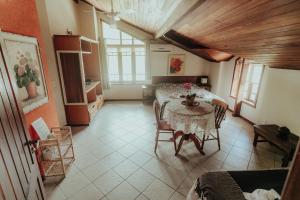 a dining room with a table and chairs in a room at Pousada Colinas da Lagoa in Florianópolis