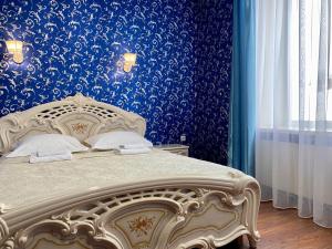 Кровать или кровати в номере Hotel Royal (Отель Роял)