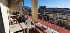 a balcony with a bench and a view of a city at Il Balconcino in Naples