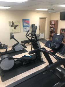 a gym with several exercise bikes in a room at Naples Dream at WTC with Heated Pool SPA Sauna 7 bicycles and 3 mls to beach in Naples