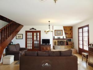 a living room with a couch and a fireplace at LIMA COTTAGES - Casa de S Tiago in Ponte de Lima