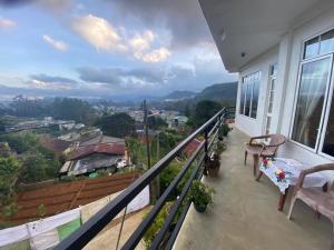 a balcony of a house with a view of a city at Zion in Nuwara Eliya