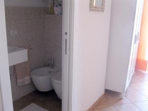 a bathroom with a toilet and a sink at Apartment Castel Gandolfo in Castel Gandolfo