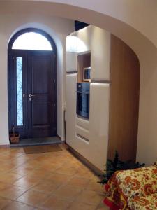 a kitchen with an archway leading to a door at Apartment Castel Gandolfo in Castel Gandolfo
