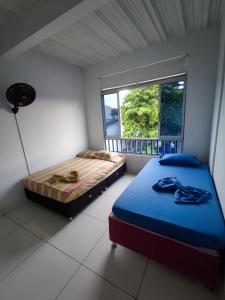 Кровать или кровати в номере Nirvana Casa de Huéspedes