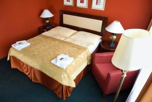 Postel nebo postele na pokoji v ubytování Hotel Rieger Garni
