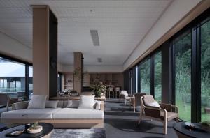 阳朔Guilin Yangshuo Nine Roots Luxury Hotel的带沙发、椅子和窗户的客厅 更多37张照片