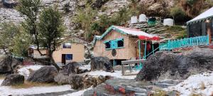 a model of a house in the snow with a train at The Solitude Camp in Pālampur