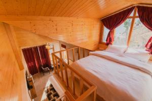 Postel nebo postele na pokoji v ubytování Kriday Villa