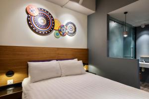 Postel nebo postele na pokoji v ubytování TOOJOU Kota Kinabalu + 57 fotografií