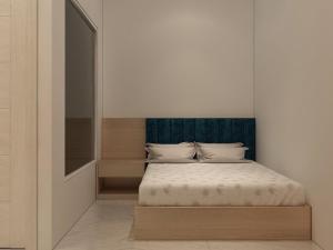 Postel nebo postele na pokoji v ubytování Thiên Thanh Hotel