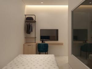 TV a/nebo společenská místnost v ubytování Thiên Thanh Hotel + 25 fotografií