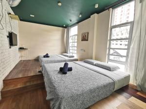 Postel nebo postele na pokoji v ubytování Snooze TOO + 10 fotografií