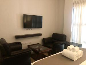 TV a/nebo společenská místnost v ubytování Seacliff Suites Hotel and Resort