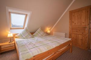 Una cama o camas en una habitación de Ferienwohnung Schmidt in Altglobsow