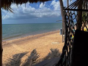 a view of the beach from a beach shack at Sea Love Beach Bar & Bungalows in Ban Tai
