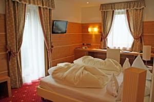 Postel nebo postele na pokoji v ubytování Hotel Zebru