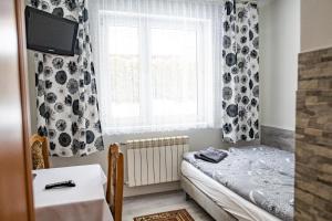Posteľ alebo postele v izbe v ubytovaní Trojanda