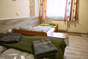Posteľ alebo postele v izbe v ubytovaní Trojanda
