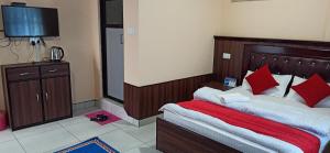 Ein Bett oder Betten in einem Zimmer der Unterkunft Hotel Royal Chautari, Butwal