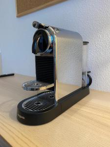 a toaster sitting on top of a desk at Appartement en face Hopital Nord in Saint-Priest-en-Jarez