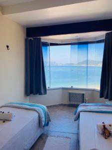 En eller flere senge i et værelse på Casa Vista Panorâmica Itaipu