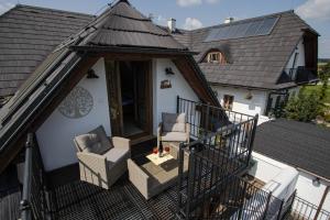 an aerial view of a house with a roof at Apartmány NA DAŘILCE in Prostřední Libchavy