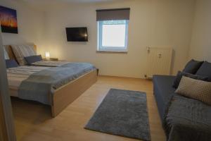 Postel nebo postele na pokoji v ubytování Komfort-Apart Paula