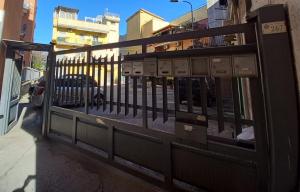 a fence on the side of a city street at Affittacamere Iria in Pomigliano dʼArco