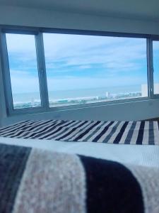 Ένα ή περισσότερα κρεβάτια σε δωμάτιο στο Apart Hotel Ulises - Club de Mar