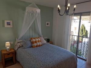 Кровать или кровати в номере Ático con encanto en Cabo de Gata. A 100m de la playa.
