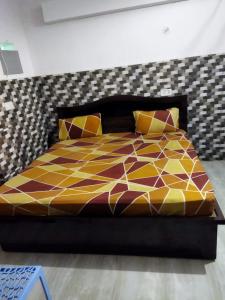 מיטה או מיטות בחדר ב-Budget Hotel