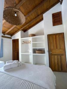 Ένα ή περισσότερα κρεβάτια σε δωμάτιο στο Casa das Corujas