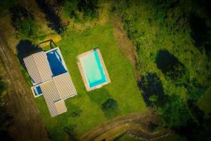 an overhead view of a house and a swimming pool at Villa Christina in Pouládes