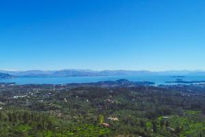 an aerial view of a city and a lake at Villa Christina in Pouládes