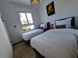 A bed or beds in a room at Residence Bali Még 28 kép