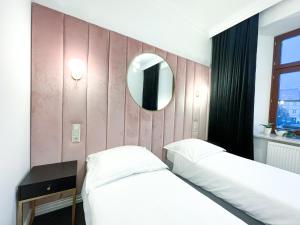 Łóżko lub łóżka w pokoju w obiekcie Apartamenty Stary Browar Oleśnica