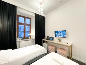 Łóżko lub łóżka w pokoju w obiekcie Apartamenty Stary Browar Oleśnica