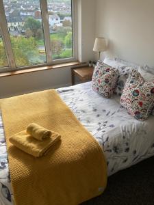 A bed or beds in a room at Long Meadow Bakery