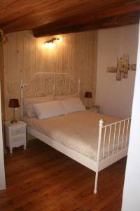 Posteľ alebo postele v izbe v ubytovaní Ca' du Barbè: tra le Alpi e il Mare