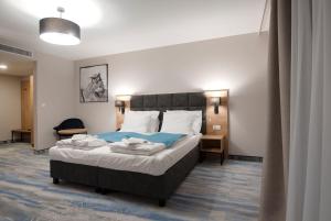 Postel nebo postele na pokoji v ubytování Hotel Jarzębata