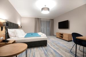 Postel nebo postele na pokoji v ubytování Hotel Jarzębata