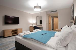 Postel nebo postele na pokoji v ubytování Hotel Jarzębata