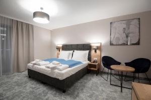 Postel nebo postele na pokoji v ubytování Hotel Jarzębata