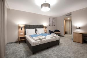 Postel nebo postele na pokoji v ubytování Hotel Jarzębata